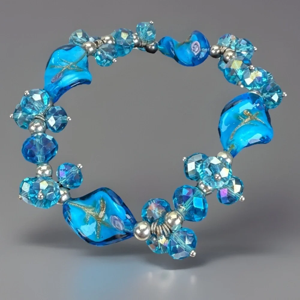 Beautiful reflective blue beaded glass stretch bracelet